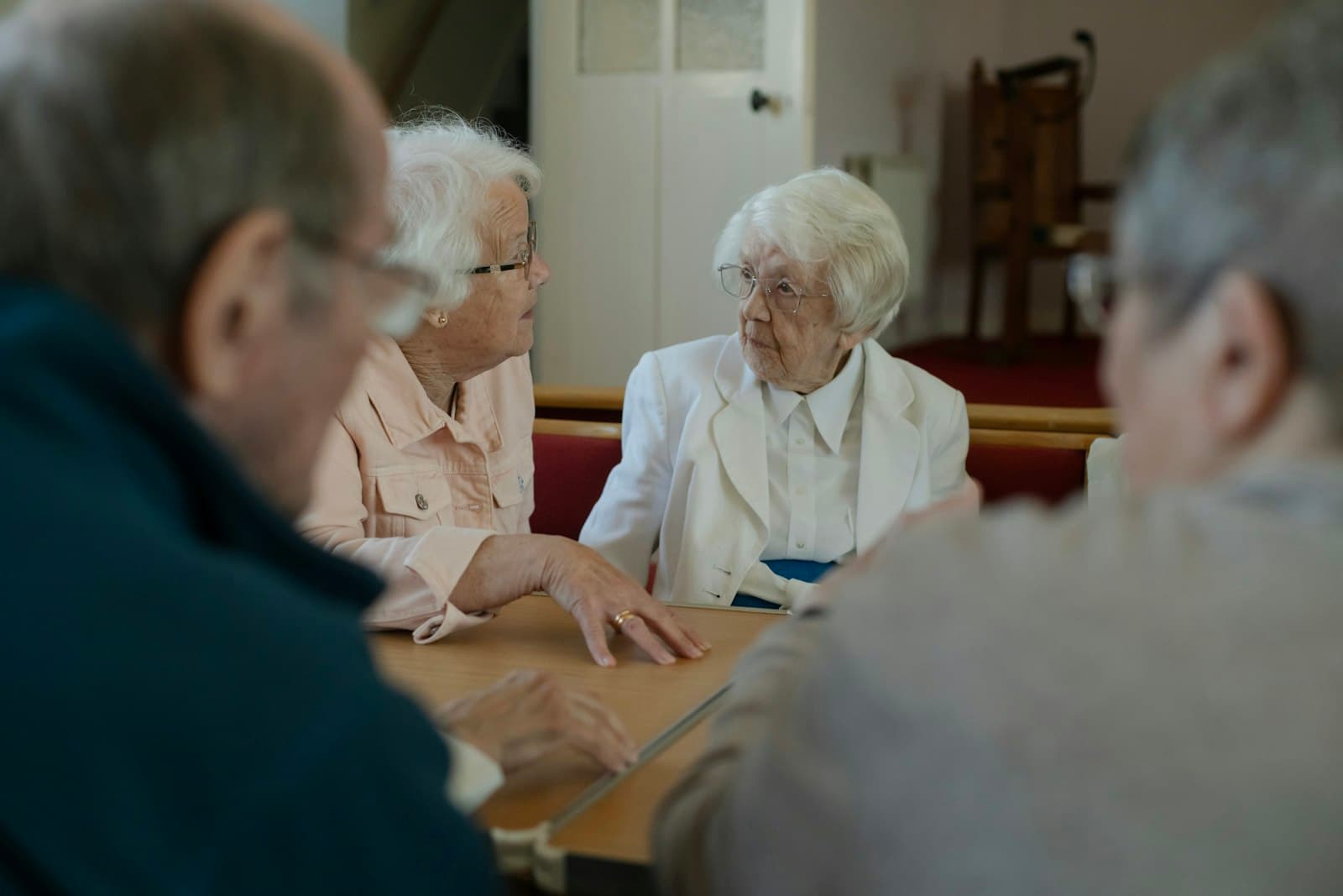 A group of seniors gathered together in conversation
